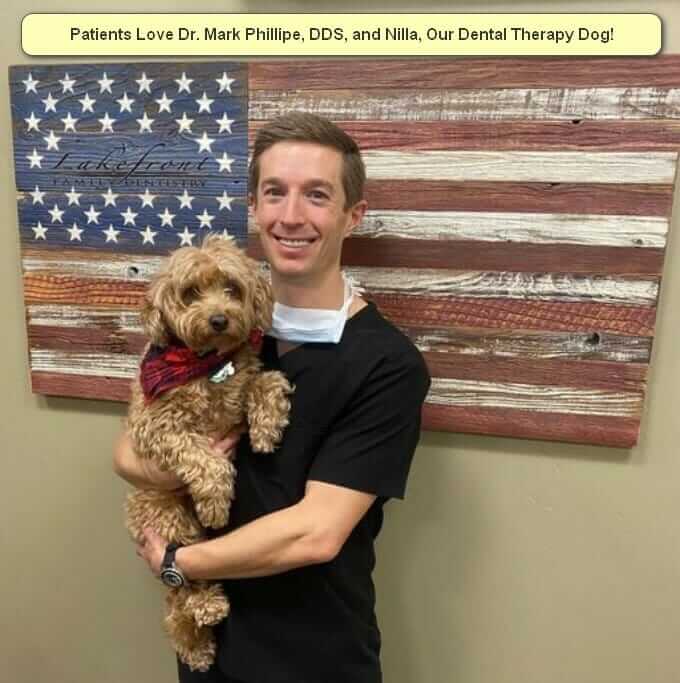 Dr. Mark Phillipe, DDS, with Nilla, One of Our Dental Therapy Dogs.