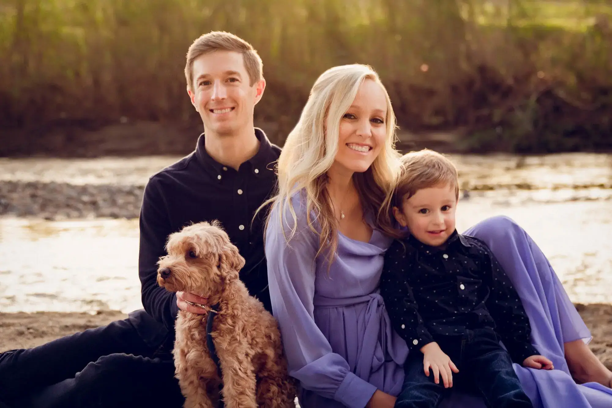 Dr. Mark Phillipe with his beautiful family and popular dental therapy dog, Nilla, at Lakefront Family Dentistry.
